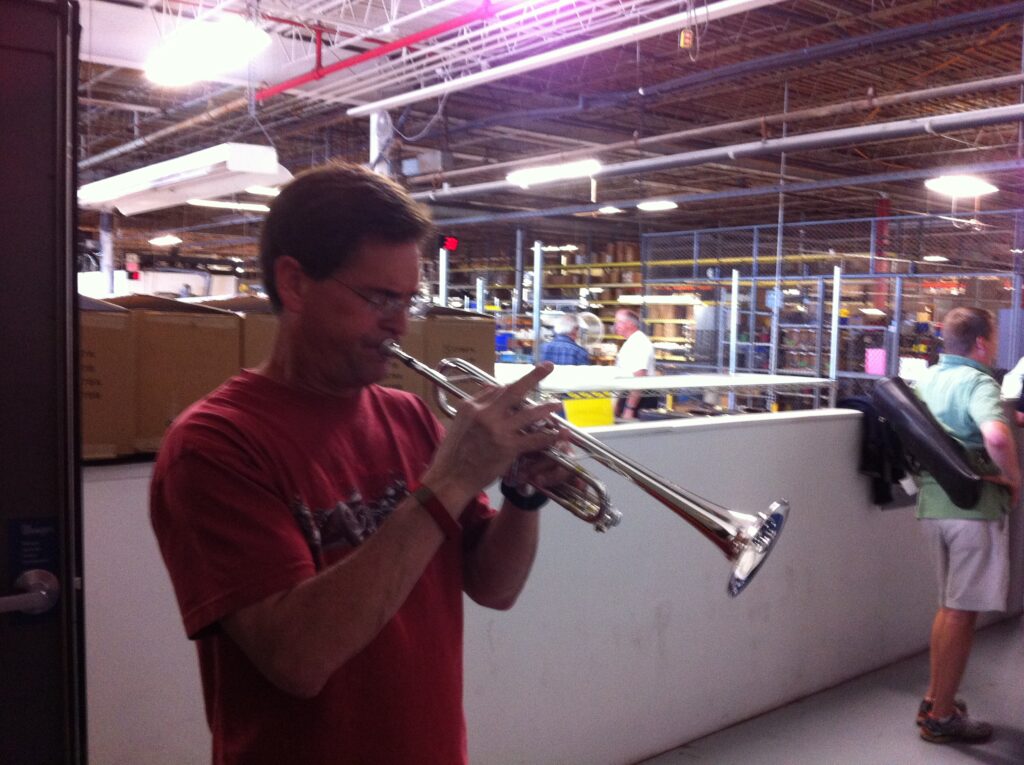 My life long friend -- Dr. Karl Sievers trying out new horns at the Bach factory